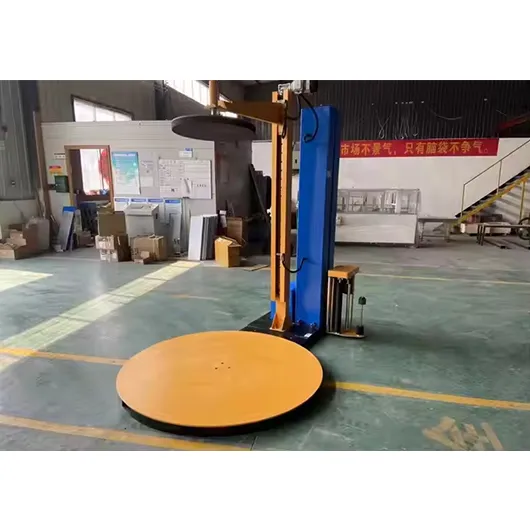 Pallet wrapping machine with top press plate