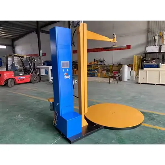 Pallet wrapping machine with top press plate