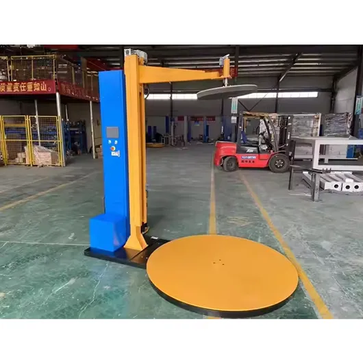 Pallet wrapping machine with top press plate